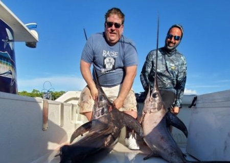  Two fishermen with their catches